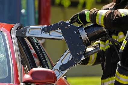 Impact of your donations shows firefighter using a vehicle rescue tool